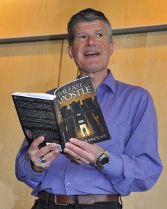 Auburnite and author Dennis Brooke reads from his book during an appearance Sunday at the Auburn Public Library.
