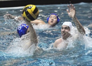 Auburn Mountainview’s Nick Helms throws the ball over Auburn’s Jesse Unzen.