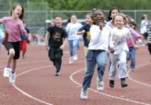 Students from Ilalko Elementary School do a fitness run at the track at Auburn Riverside High School last week.  The annual one-mile fun run was for all the students