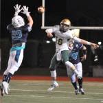 Auburn Riverside&rsquo;s Alex Caldwell attempts to block a throw from Auburn quarterback Zach Redelf during NPSL play Friday night. RACHEL CIAMPI, Auburn Reporter