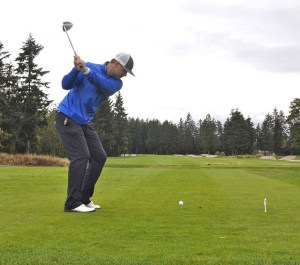 Ryan Chipp tees off during the Scramble for Safe Families Golf Tournament at Washington National last Saturday. Proceeds from the tournament benefitted the Jennifer Beach Foundation in its efforts to provide education