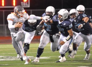 Auburn Mountainview’s Talan Alfrey tries to escape Auburn Riverside’s pursuing defense during North Puget Sound League Olympic Division 4A play Friday night. RACHEL CIAMPI