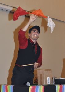 Magician John London performs a trick during the Ladies & Lil Gents event at the Auburn Park