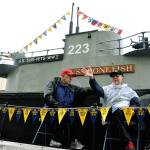 Auburn Veterans Day Parade co-grand marshals and World War II submariners Ralph R. Sterley, left, and Paul Christofferson wave to the crowd last Saturday. The parade paid special tribute to the United States Submarine Veterans, Inc. RACHEL CIAMPI, Auburn Reporter