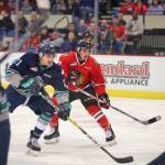 The Thunderbirds&rsquo; Matthew Wedman battles the Winterhawks in WHL play at Veterans Memorial Coliseum on Saturday night. COURTESY PHOTO