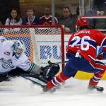 Thunderbirds goalie Rylan Toth slides to make a save on a shot by the Chiefs&rsquo; Hudson Elynuik during WHL play Tuesday night. COURTESY PHOTO