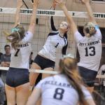 The Ravens&rsquo; Anna Maracich delivers a spikes between the Bellarmine Prep defense during the district championship Saturday at Kentwood High School. RACHEL CIAMPI, Auburn Reporter