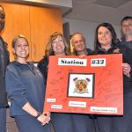 The VRFA contingent of, from left, Gervase Henson, Erica Bartlett, Kimberly Terhune, Terry Robinson, Kelly Hawks, Steve Zehnder and Tyler Eliason hold a Latino Club poster. RACHEL CIAMPI, Auburn Reporter