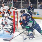 The Thunderbirds&rsquo; Donovan Neuls looks to circle around and fire a shot at Tigers goalie Duncan McGovern during WHL play Saturday night at the ShoWare Center. COURTESY PHOTO, Brian Liesse, Thunderbirds
