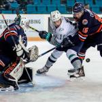 The Thunderbirds&rsquo; Donovan Neuls battles the Blazers&rsquo; Nick Chyzowski for the puck in front of Kamloops goalie Connor Ingram during WHL play Wednesday night. COURTESY PHOTO, Allen Douglas