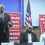 Gov. Jay Inslee speaks to a gathering at the Abu-Bakr Islamic Center in Tukwila on Friday. Abdirisak Ahmed (Mahad), the center&rsquo;s director, middle, and Shiekh Ahmed Nur, Iman of the center, right, listen. MARK KLAAS, Kent Reporter