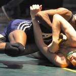 Auburn Riverside&rsquo;s Yusef Nelson rides Auburn&rsquo;s Jake Aplin during their 113-pound title bout at the sub-regional wrestling tournament at Auburn High School on Saturday. Nelson posted a 13-5 decision. RACHEL CIAMPI, Auburn Reporter