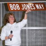 Mayor Nancy Backus hoists the new name – Bob Jones Way – that will run between the school and Auburn Memorial Stadium along Fourth Street Northeast. RACHEL CIAMPI, Reporter