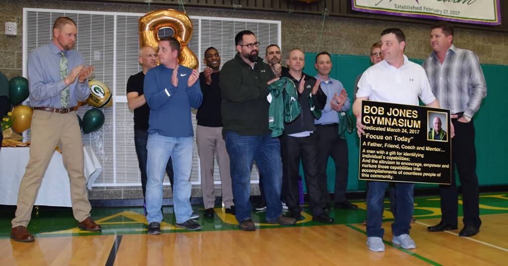 Members of the 1992 Auburn High football team talk about their late coach, Bob Jones, at the dedication ceremony. RACHEL CIAMPI, Reporter