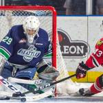 The Winterhawks&rsquo; Sykler McKenzie fires a shot at Thunderbirds goalie Matt Berlin during WHL play Saturday night at the ShoWare Center. Portland outshot Seattle in the game 41-32 to take a 4-1 win, denying Seattle of a second straight division title. COURTESY PHOTO, Brian Liesse, T-Birds.