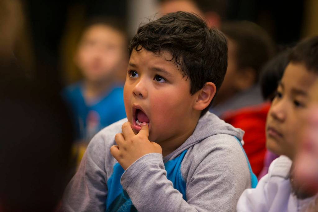 A student at Arthur Jacobsen Elementary School wiggles his tooth for the Delta Dental of Washington Tooth Fairy. COURTESY, VanHouten Photography