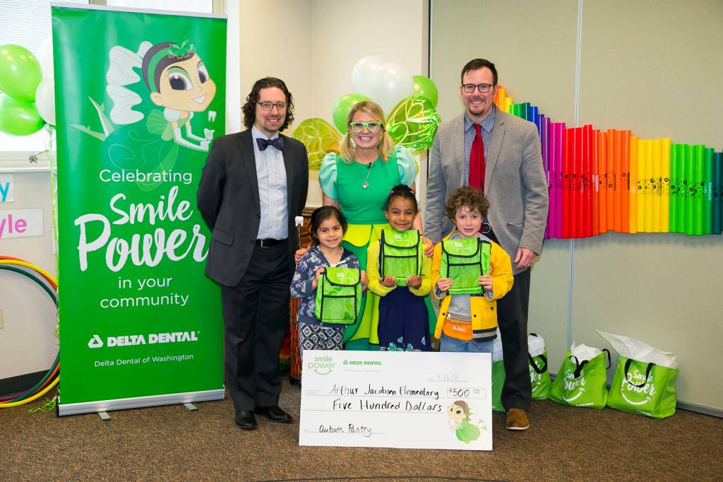 Representatives from Arthur Jacobsen Elementary School receive a $500 donation for the Auburn Pantry Program from the Delta Dental of Washington Tooth Fairy. COURTESY, VanHouten Photography