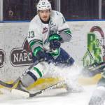 The Thunderbirds&rsquo; Mathew Barzal drives the puck away from the boards during WHL playoff action Tuesday night at the ShoWare Center. Barzal scored twice, including the game-winning shot, to lead Seattle past the Everett Silvertips 5-4 for a commanding 3-0 lead in their best-of-seven Western Conference semifinal series. COURTESY PHOTO, Brian Liesse, T-Birds.