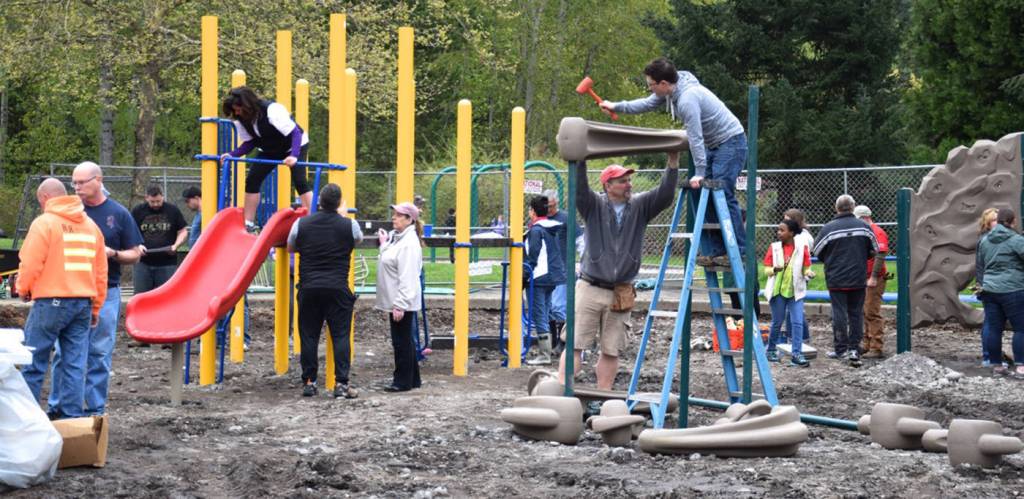 Volunteers build and help restore the playground at Roegner Park. RACHEL CIAMPI, Auburn Reporter