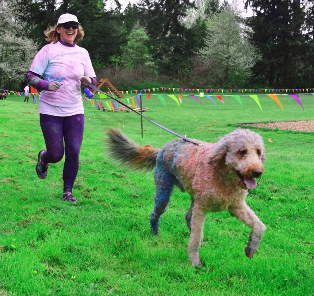 TL Lenhardt runs with her dog Chase in the color run, RACHEL CIAMP, Auburn Reporter