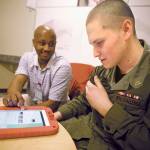 Darwin Wiggins, a case manager at the Washington Youth Academy, provides guidance to Cadet Ethan Wallace of Auburn. COURTESY PHOTO