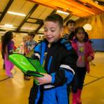 Students at Washington Elementary School receive Smile Power lunch bags with the book The Berenstain Bears Visit the Dentist and a toothbrush inside from the Delta Dental of Washington Tooth Fairy. COURTESY, VanHouten Photography