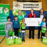 Representatives from Washington Elementary School receive a $500 donation for the Auburn Pantry Program from the Delta Dental of Washington Tooth Fairy. COURTESY, VanHouten Photography