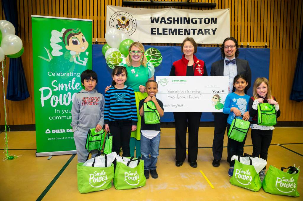 Representatives from Washington Elementary School receive a $500 donation for the Auburn Pantry Program from the Delta Dental of Washington Tooth Fairy. COURTESY, VanHouten Photography