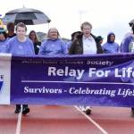 Cancer survivors walk with Crystal Tate and Marci Killian holding the sign. RACHEL CIAMPI, Reporter                                Cancer survivors walk. RACHEL CIAMPI, Reporter