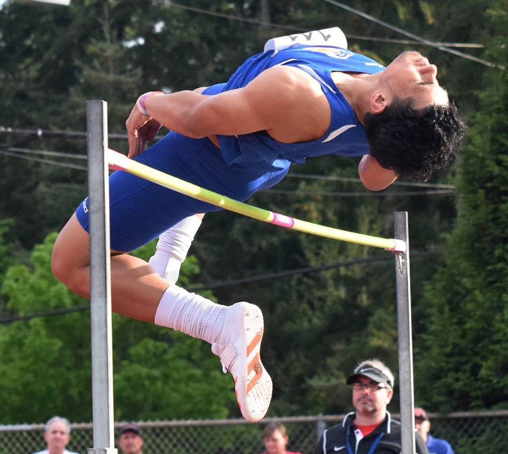 The Lions&rsquo; Benjamin Mose climbs a season-best 6-4 to finish second in the high jump. RACHEL CIAMPI, Auburn Reporter