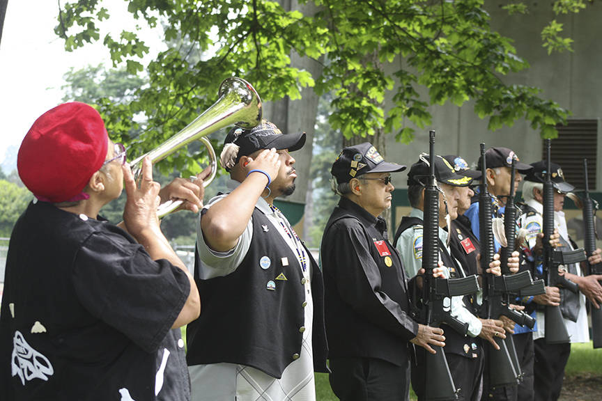 Members of the Inter-Tribal Warrior Society perform a rifle salute and &ldquo;Taps.&rdquo; MARK KLAAS, Auburn Reporter