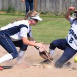 Auburn Riverside&rsquo;s Madison Muxen tries to put out a Rogers runner at second base during district fastpitch play Sunday at Enumclaw. RACHEL CIAMPI, Auburn Reporter