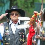 Bob Sison, veteran and chaplain of the Inter-Tribal Warrior Society, salutes during the Memorial Day ceremony at Auburn&rsquo;s Veterans Memorial Park on Monday. MARK KLAAS, Auburn Reporter
