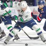 The Thunderbirds&rsquo; Scott Eansor tries to control the puck against the Pats during Game 4 WHL championship series action Wednesday night at the ShoWare Center. COURTESY PHOTO, Brian Liesse/T-Birds