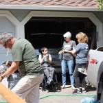 Nice gesture: Mayor Nancy Backus visits Trenton Heuring Smart and a friend while volunteers build a ramp for the Auburn boy last Saturday. COURTESY PHOTO