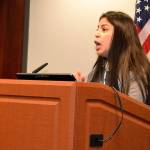 Making a point: Erandy Flores, 16, urges the City Council to adopt an ordinance, declaring Auburn a sanctuary city. ROBERT WHALE, Auburn Reporter