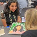 Andrea Alvarez has her worked reviewed by Allison Hyde, the arts coordinator for Auburn High School. COURTESY PHOTO, Jaclynn Board