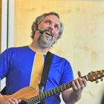 Eric Herman sings to his young audience at the Auburn Library on Saturday. MARK KLAAS, Auburn Reporter