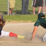 Auburn&rsquo;s Jay Mentink tags out Federal Way National&rsquo;s Kayla Johnson between second and third base, ending a scoring threat in the fifth inning of the District 10 finals on Friday. RACHEL CIAMPI, Auburn Reporter