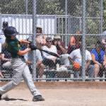Austin Ellsworth smacks one of his two home runs for the Auburn Little League Majors against Bainbridge Island. RACHEL CIAMPI, Auburn Reporter