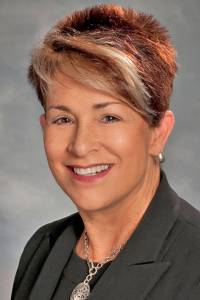 Wales explains her absence on car tab fee vote