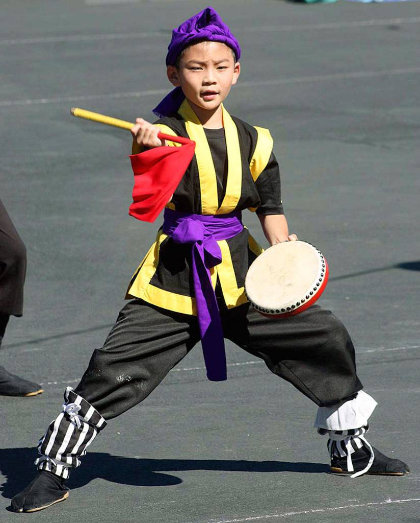 A young member of the Okinawa Kenjin-Kai Eisa Taiko group, performs. MARK KLAAS, Auburn Reporter