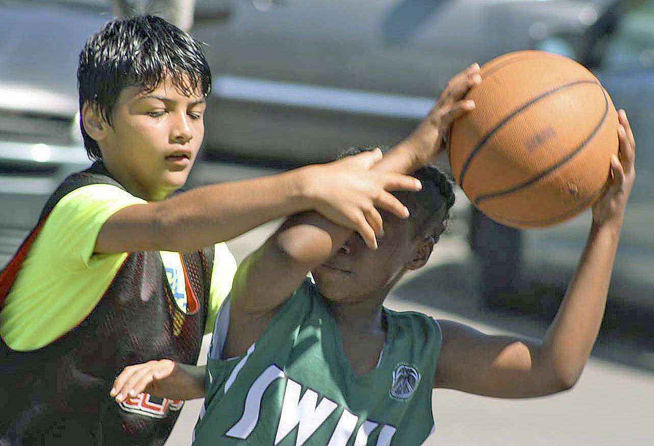 Kandola Chahatpreet of Kent&rsquo;s Storm Elite defends ball-handling Madison Pegram of Newcastle&rsquo;s Swish Hopkins in fifth-grade girls action at the ShoWare Shootout. MARK KLAAS, Kent Reporter