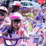 Teagan, left, and Taylor Bartos, middle, lead the way for the Kids&rsquo; Bike Parade. MARK KLAAS, Auburn Reporter