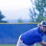 Jacob Phillips, a 2010 Auburn Mountainview graduate, fires a pitch during an alumni baseball game between the Lions and rival Auburn on the Auburn Mountainview High School diamond last Saturday. Phillips, who coaches at Pierce College, joined other top players from Auburn&rsquo;s past glory days for a friendly game. MARK KLAAS, Auburn Reporter