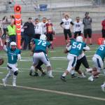 Auburn Riverside quarterback Tiano Malietufa turns to hand off to Javon Forward as Isaiah Prescott makes a play-action move during the Ravens&rsquo; 52-0 demolition of Thomas Jefferson on Sept. 14. COURTESY PHOTO, Jamie Malietufa