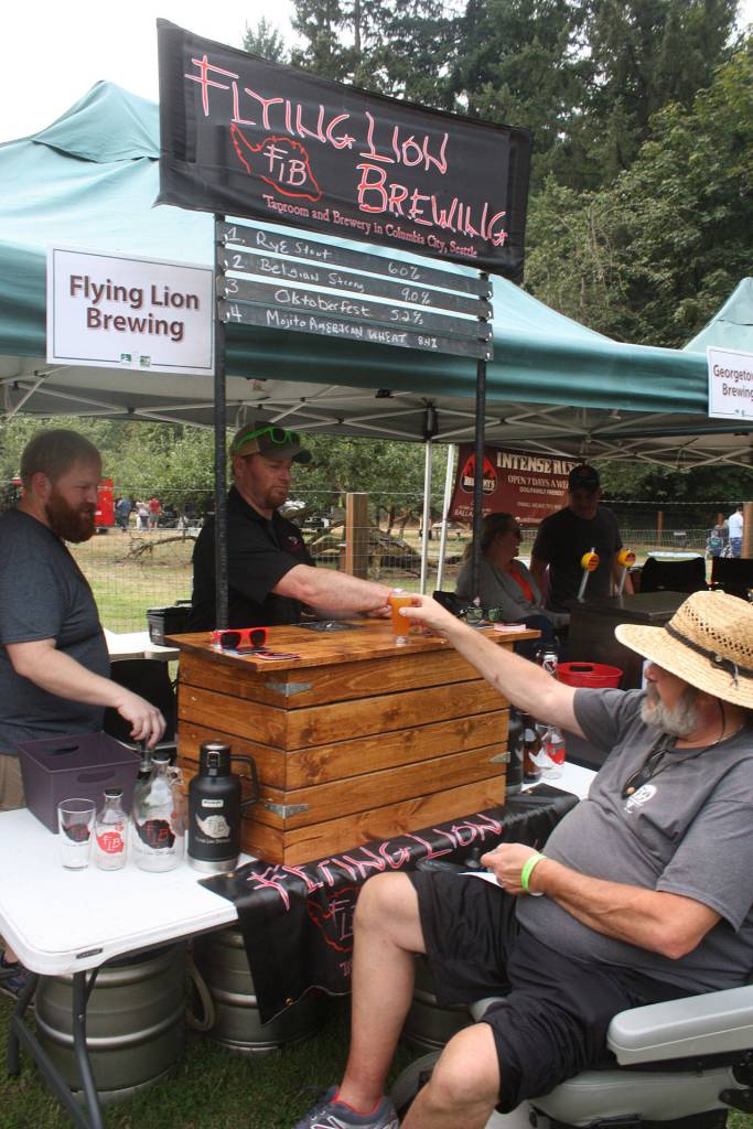A patron gets a taste of a beer. MARK KLAAS, Auburn Reporter