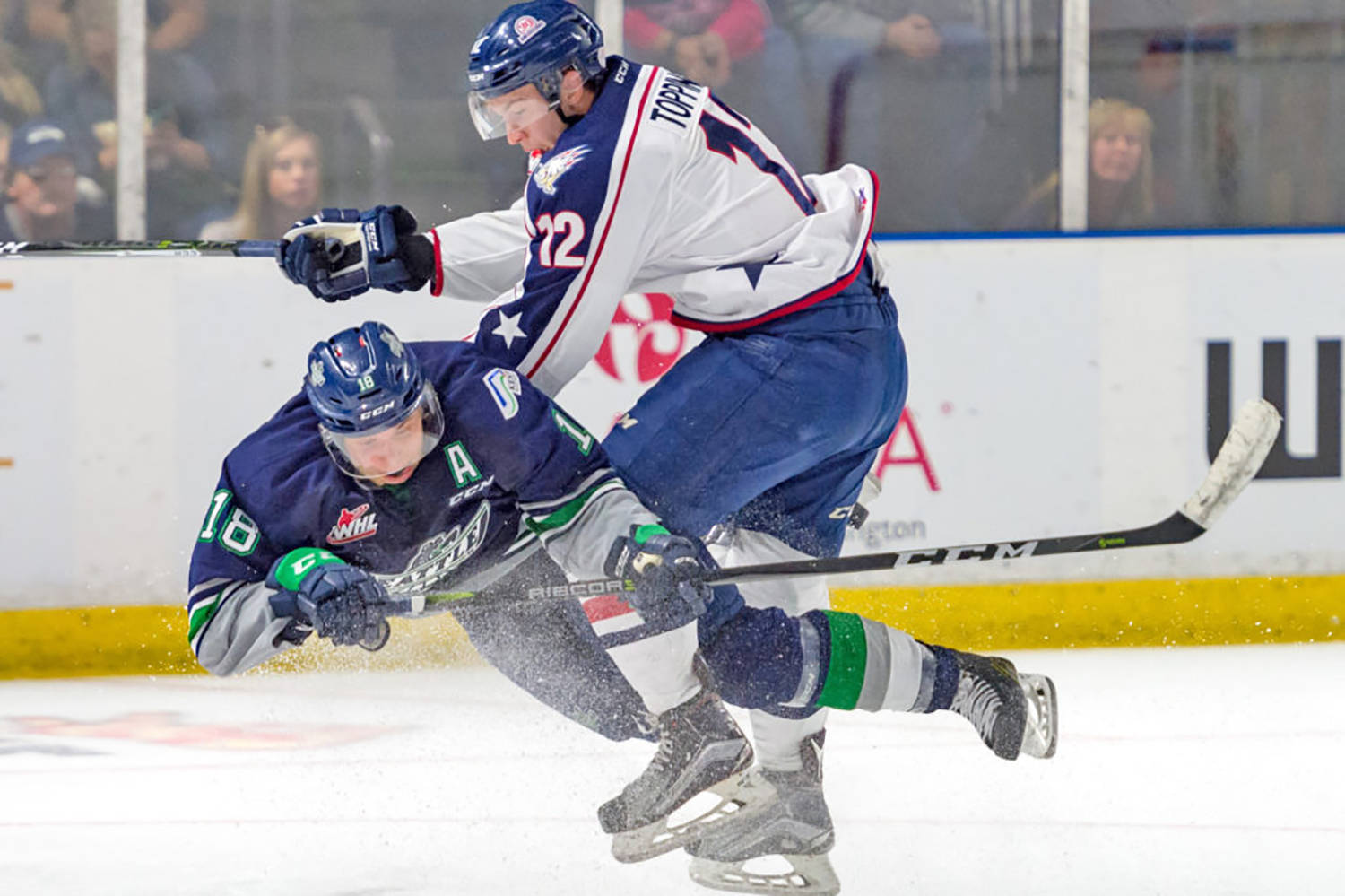 The Thunderbirds&rsquo; Sami Moilanen, left, and the Americans&rsquo; Jordan Topping collide on the ice during season-opening WHL play Saturday night. COURTESY PHOTO, Brian Liesse, T-Birds