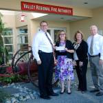 At the check presentation were, from left, Eric Robertson, Valley Regional Fire Authority administrator; Carol Greiling, general manager, Auburn Reporter; Nancy Backus, Auburn mayor and chairman of VRFA Board of Governance; and Police Chief Bob Lee. COURTESY PHOTO
