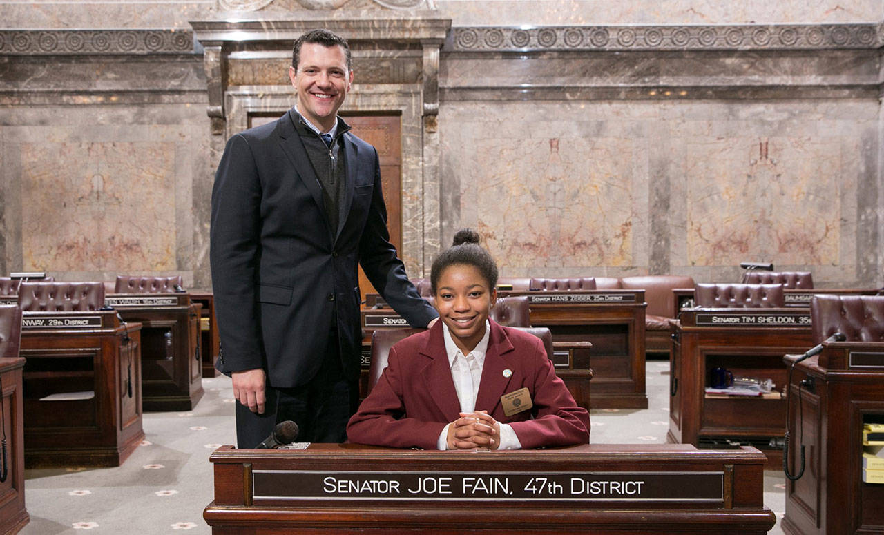 Sen. Joe Fain, with Chinyere Naome Brent, a student from Kents Technology Access Foundation Academy, during the last legislative session at the Capitol in Olympia. COURTESY PHOTO